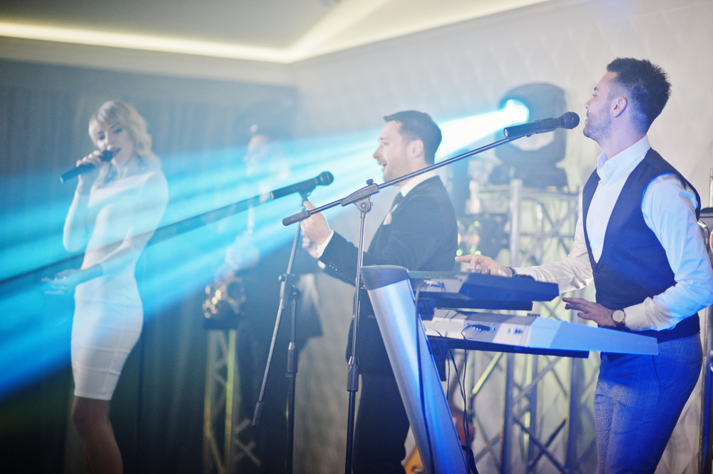 Live_Music_Wedding_Band_Performing_On_A_Stage_With_Lighting